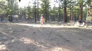 Naked walk on a dirt road.